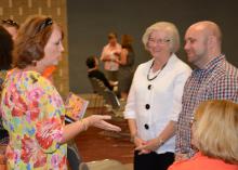 Bridget Fulton, left, a child care provider from Meridian, talks with Karen Ponder and Chad Allgood, Mississippi State University Early Years Network consultants. The Early Years Network went on the road in October to discuss changes in the program made to better serve child care providers across the state. (Photo by MSU School of Human Sciences/Amy Barefield)