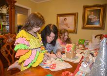Adrienne Mercer (center) of Louisville, Mississippi, assists her daughter, Millie Kate, in a salt-dough ornament project on Dec. 13, 2014. Family friend Anna Claire Quinn also enjoyed doing fun projects that can build important learning skills and relationships. (Submitted Photo)