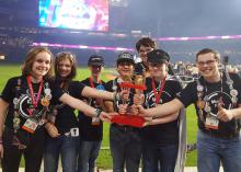 The Rankin County 4-H robotics team, Wait For It, was in the winning alliance of three teams at the FIRST Tech Challenge in Houston, Texas. Members Lilli Stewart, left, Lauren Blacksher, Noah Gregory, Maisyn Barragan, Jordan Hariel, Logan Hariel and Mathew Blacksher are on the playing field of Minute Maid Park in front of 25,000 people to receive their award on April 22, 2017. (Submitted Photo)