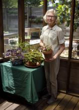 Lida McDowell holds an alternanthera plant at her home in Hattiesburg, Mississippi, on April 27, 2017. McDowell is a member of the Pine Belt Master Gardeners -- one of more than 60 such groups throughout the state that operate under the supervision of the Mississippi State University Extension Service. (Photo by MSU Extension Service/Kevin Hudson)