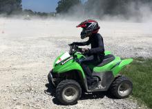 Safety gear for ATV riding includes helmets, gloves, long pants and long sleeves. Young people should ride ATVs designed for their size rather than full-size ATVs designed for adult riders. (Photo by MSU Extension Service/Bonnie Coblentz)