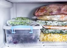 Frozen foods sit in the freezer.