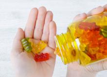 Closeup of gummy vitamins in a child’s hand