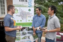 Mississippi State University senior landscape architecture student Owen Harris (left) speaks to Ranjit Amgai (center), an electrical engineering graduate student from Nepal, and Shengyi Pan, a computer engineering doctoral student from China, about the role of landscape architects in the environment. Landscape architects and students are celebrating National Landscape Architecture Month with outreach activities to promote their program and discipline. (Photo by MSU Ag Communications/Scott Corey)
