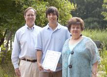 Andrew Shaman, center, a senior majoring in forestry at Mississippi State University, received a $3,500 scholarship from the National Garden Clubs. The award was presented by Ann Chiles, scholarship chairwoman for the Garden Clubs of Mississippi, and Ian Munn, dean of MSU’s College of Forest Resources. Shaman is the son of Chris and Felicia Shaman and a resident of Brandon. (Photo by MSU College of Forest Resources/Karen Brasher)
