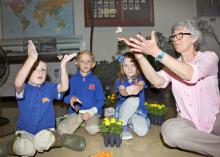 From left, kindergarteners Garrison Baker, Knox Smith and Piper Graves learn about painted lady butterflies with Lois Connington, keeper of the Insect Zoo at Mississippi State University’s Clay Lyle Entomology Building on Thursday, April 14, 2016 in Starkville, Miss. (Photo by MSU Extension Service/Kat Lawrence)