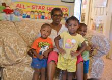 Katherine Weatherby is surrounded by her 2-year-old grandchildren (from left) Zirean Davis, G’Niereya Alston and Bryson Ward at her home in Sallis, Mississippi, on Aug. 20, 2015. (Photo by MSU Human Sciences/Amy Barefield)