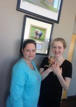 Christy Little, left, meets with Bridget Monk and her dog, Princess Paisley, at the Animal Emergency and Referral Clinic in Flowood. Monk received funds donated in memory of the Little’s dog, Gabbie, for those in need of help to pay for veterinary care. (Submitted photo)
