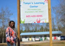 LaTonya Hill stands outside Tonya’s Learning Center, her new licensed child care center in Waynesboro, Mississippi on Feb. 18, 2016.