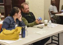 Althea and Joel Bontrager of Columbus examine a communication ball at the beginning of a three-hour workshop for foster/adoptive parents in the Oktibbeha County Extension Office on March 19, 2016. (Photo by MSU Extension Service/Kevin Hudson)