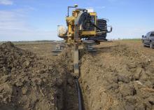 Plastic tubing is buried in farmland at precise depths and locations to drain off excess water from areas where too much moisture hampers crop yields. This drain tile was installed Nov. 8, 2016, at a Noxubee County field near Brooksville, Mississippi. (Photo by MSU Extension Service/Kevin Hudson)