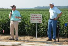 Jason Krutz (left), irrigation specialist for the Mississippi State University Extension Service, and Normie Buehring, research professor at the Northeast Mississippi Experiment Station, discuss soybean irrigation at the 2014 North Mississippi Research and Extension Center Agronomic Row Crops Field Day. The biennial event will be Aug. 11, 2016 in Lee County. (File Photo/ MSU Extension Service) 