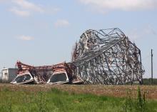 This 300-foot microwave communications tower in Noxubee County lies on the ground the day after it took a direct hit by an April 11, 2013, tornado. (Photo by MSU Extension Service/Dennis Reginelli)