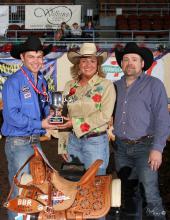 Bricklee Miller, manager of the Mississippi Horse Park at Mississippi State University, receives the Better Barrel Racing Association's Producer of the Year trophy from Garrett Yerigan, left, and Destry Fleming at the barrel racing finals in Oklahoma City on April 26, 2014. (Submitted Photo)