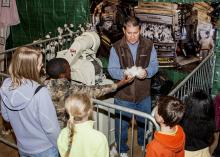 Mississippi State University Extension Service regional agronomic crops specialist Dennis Reginelli shows students cotton at the FARMtastic Mighty Crops station on Nov. 11, 2013. The third annual FARMtastic will take place this year from 9 a.m. until 1 p.m. Nov. 10-15 at the Mississippi Horse Park near Starkville. (File photo by MSU Ag Communications/Scott Corey)