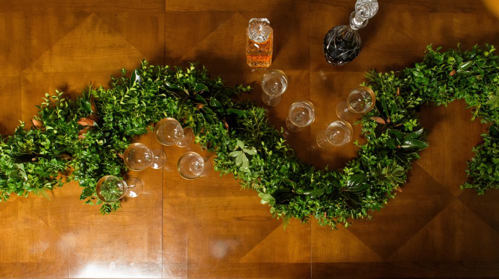 Green garland on a table.