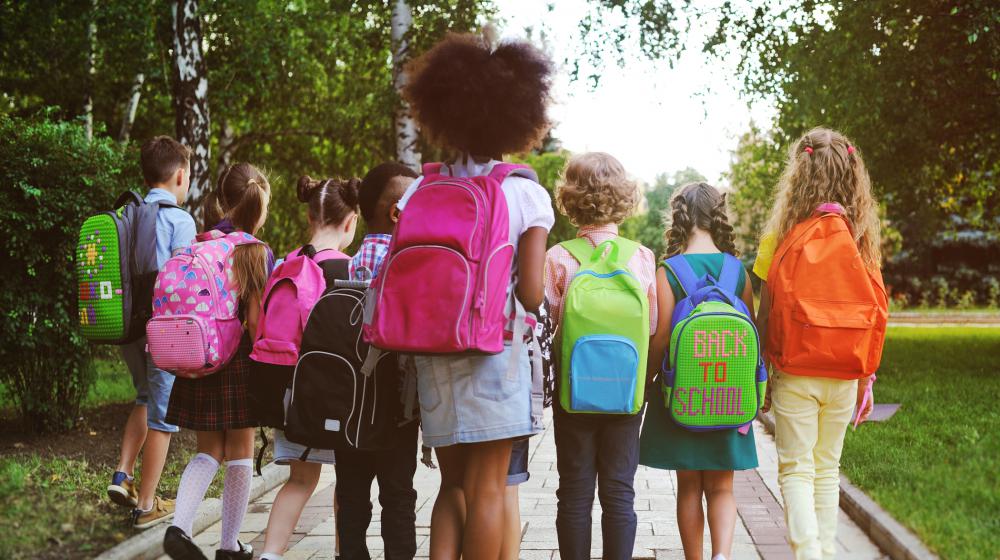 Children wearing backpacks.