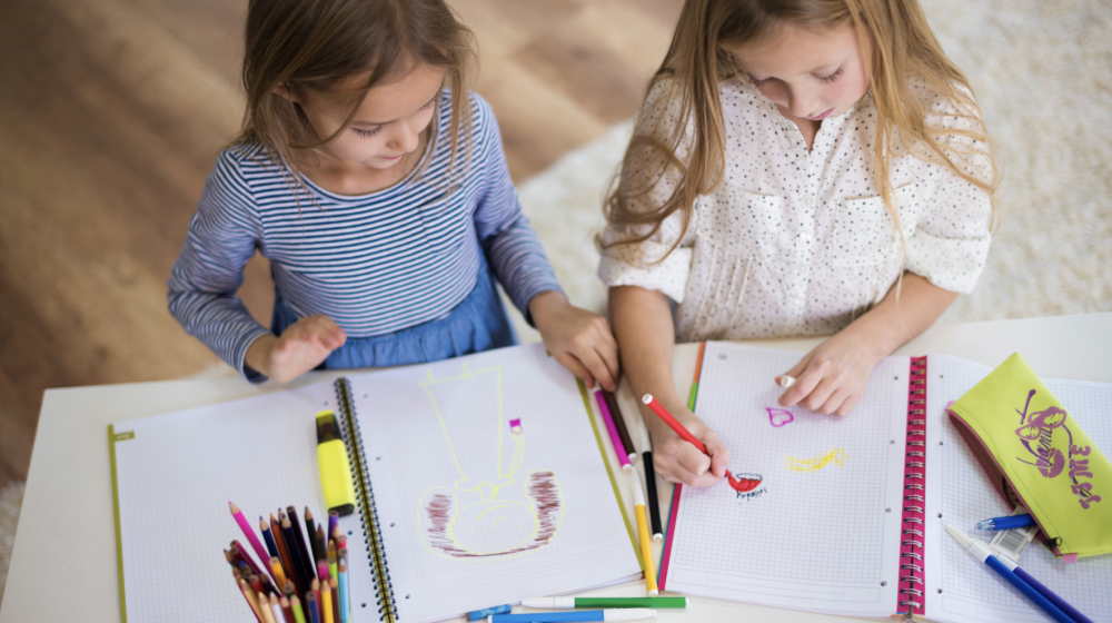 Two girls coloring.