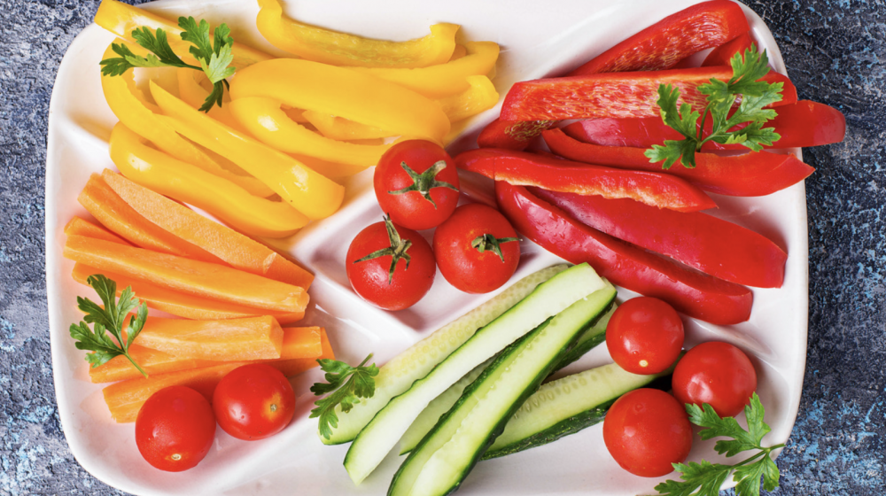 sliced bell peppers and cucumbers on a plate