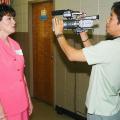 Danette Blackwell, a business and computer technology teacher at Hattiesburg High School, answers questions on camera for Sunghan Lee, a television producer from South Korea. Lee was taping for a documentary he is preparing on financial education for young people.