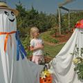 Sidney Dobbs of Hamilton enjoys a visit with some of the ghostly residents of the Scarecrow Trail. The trail winds through the gardens at the North Mississippi Research and Extension Center in Verona and is open to the public on weekdays through Oct. 25. 