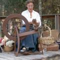 Yvette Rosen demonstrates spinning to guests of a previous Piney Woods Heritage Festival at Crosby Arboretum. The festival provides an opportunity to learn about the arts and heritage crafts of the region. (Photo courtesy of Crosby Arboretum)