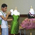 MSU freshman Jay Grishby of Jackson puts the finishing touches on his haute couture cocktail dress that was featured in a recent campus fashion exhibit.