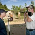 Luke South of Tishomingo County receives instruction from Coach William Baldwin at the Mississippi 4-H National Shooting Sports team practice held at the Starkville Gun Club. (Photo by Scott Corey)