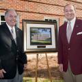 The newly renovated and renamed Lloyd-Ricks-Watson building at Mississippi State University was dedicated on Oct. 23. Vance Watson, left, one of the buildings' namesakes, receives a photo of the building from MSU president Mark Keenum. (Photo by MSU University Relations/Russ Houston)