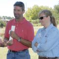 Dan Batson, owner of GreenForest Nursery, visits with Patricia Knight, head of the Mississippi State University Coastal Research and Extension Center, at the 2010 Ornamental Horticulture Field Day. (Photo by Cheree Franco)