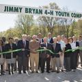 Mississippi State University Extension Service 4-H representatives, state and local officials, and industry representatives enjoy a beautiful day for a ribbon-cutting ceremony for the Jimmy Bryan 4-H Youth Complex in West Point April 10, 2014. Participants include Paula Threadgill, (front row, left), Angela Turner-James, Hobson Waits, Jimmy Bryan, Floyd McKee, Barney Jacks, Robbie Robinson, Paige Lamkin and Amy Berry; Lynn Horton (back row, left), Shelton Deanes, Preston Sullivan, Russell Jolly, Gary Jackso