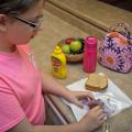 When packing lunches, children and adults need to follow good hygiene and food safety practices, such as starting with clean hands, a clean work surface and a clean lunch box. (Photo by MSU Ag Communications/Kevin Hudson)