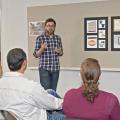 On Nov. 6, 2014, Austin Edwards, a Mississippi State University senior graphic design major from Gulfport, explains his concept in class for a new brand image for Earp Farms in Houlka. (Photo by MSU Ag Communications/Kat Lawrence)