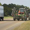 Combine driving on the road.