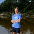 Abby Braman standing in a creek.