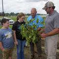 Two MSU Extension agronomy specialists instruct youth campers.