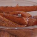 Oven-roasted carrots in a clear glass bowl