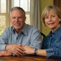 A man and woman sit at a table.