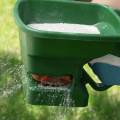 A person using a green manual fertilizer.