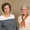 Two women philanthropists smiling.