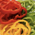 Sliced red, yellow and green bell peppers