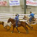 Jake Fulgham, the header, and Ty Edmondson, the heeler, take part in a team roping event at the 4-H Spring Rodeo Classic in April 2016 at the Chickasaw County Agri-Center.  (Photo by MSU Extension Service/Susan Fulgham)