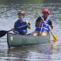 Young campers paddle across a lake during a Mississippi State University conservation camp in 2015. (Photo by MSU Extension Service/Kevin Hudson)