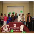 A group of teenagers pose for a photo celebrating their induction as 4-H Leadership team members.