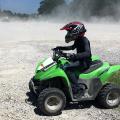 Safety gear for ATV riding includes helmets, gloves, long pants and long sleeves. Young people should ride ATVs designed for their size rather than full-size ATVs designed for adult riders. (Photo by MSU Extension Service/Bonnie Coblentz)