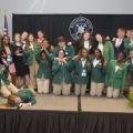 A group of 4-H’ers make silly gestures.
