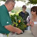 John Michael Anderson, a research associate with the Mississippi Agricultural and Forestry Experiment Station, explains propagating daylilies from seed to Penny Smith during the Ornamental Horticulture Field Day Oct. 10 at Mississippi State University’s South Mississippi Branch Experiment Station in Poplarville. Leisure gardeners and horticulture industry professionals learned about the latest research findings, new plant varieties and helpful technologies. (Photo by MSU Ag Communications/Susan Collins-Smit