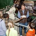 Dennis Reginelli, an area agronomic crops agent with the Mississippi State University Extension Service, explains the ginning process that helps create cotton fabrics. Addressing primarily third-graders at the Mississippi Horse Park on Nov. 7, 2013, Reginelli and the cotton exhibit were part of Farmtastic, a four-day educational program designed to help children learn the sources of their food, clothing and other products. (Photo by MSU Ag Communications/Scott Corey)