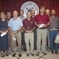 Regions Bank representatives joined Mississippi State University Division of Agriculture, Forestry and Veterinary Medicine administrators and faculty to recognize the winners of the 2014 Regions Bank-DAFVM, MSU Superior Faculty Awards on July 25, 2014. Back row, from left: Walt Stephens, Regions Greenville City president; Gregory Bohach, DAFVM vice president; Samuel W. Slaughter III, Regions Starkville City president; and George Jarman, Regions Delta City president. Front row, from left: Service Award winne
