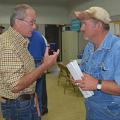 Winston County Extension agent Mike Skipper, left, discusses recovery issues from the April 2014 tornado with Rusty Suttle of Louisville at an Agricultural Disaster Resource Center set up May 15, 2014. (File photo by MSU Ag Communications/Linda Breazeale)